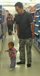 Amelia walking with her Daddy